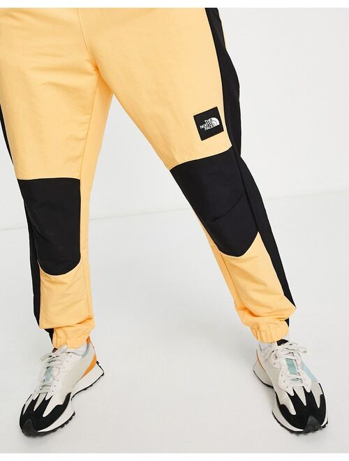The North Face Phlego track sweatpants in orange
