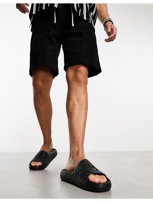 ASOS DESIGN chunky slides with texture in black