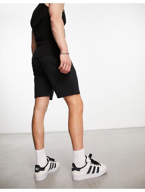 COLLUSION jersey shorts in black