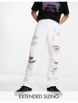baggy jeans with heavy rips in white