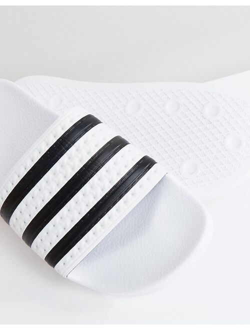 adidas Originals adilette sliders in white and black