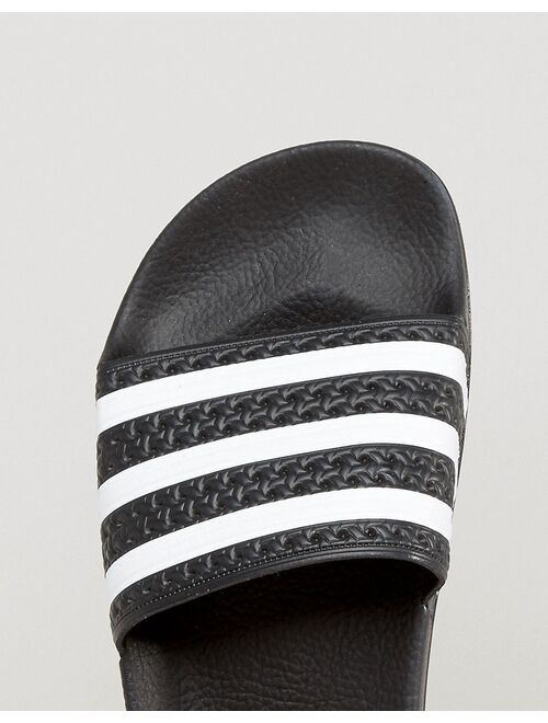 adidas Originals adilette sliders in black and white
