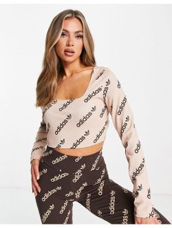 'Logomania' repeat logo long sleeve cropped top in blush