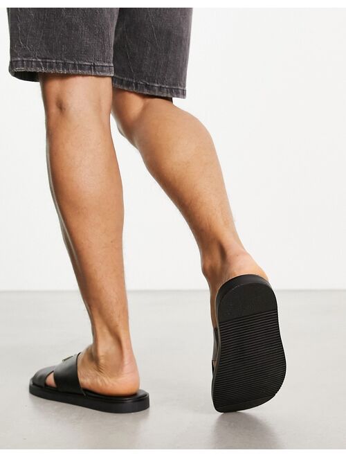 ASOS DESIGN cross strap sandals in black saffiano leather with badge