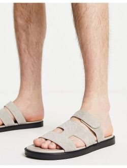 leather sandals in textured stone leather with contrast black sole