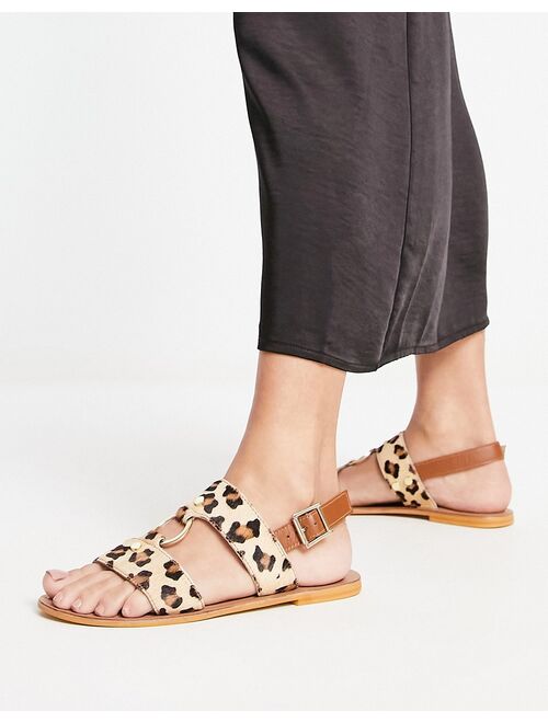 ASOS DESIGN Fancy leather ring and stud detail flat sandals in leopard