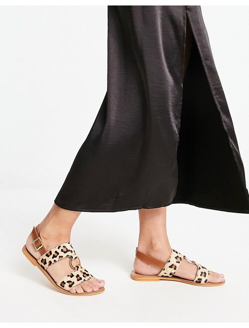 ASOS DESIGN Fancy leather ring and stud detail flat sandals in leopard