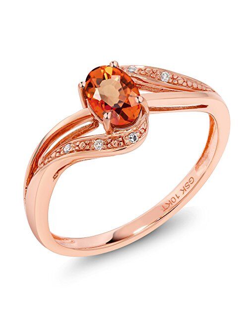 Gem Stone King 10K Rose Gold Orange Sapphire and White Diamond Engagement Bypass Ring For Women (0.59 Cttw, Oval 6X4MM, Available 5,6,7,8,9)