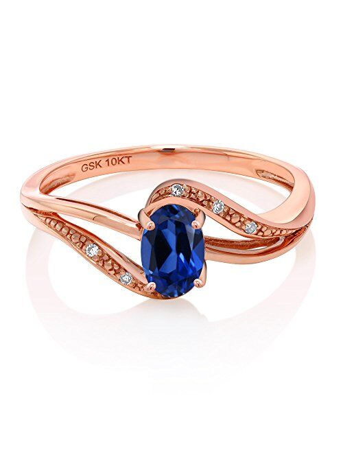 Gem Stone King 10K Rose Gold Blue Created Sapphire and Diamond Women's Engagement Bypass Ring (0.54 Ct Available 5,6,7,8,9)