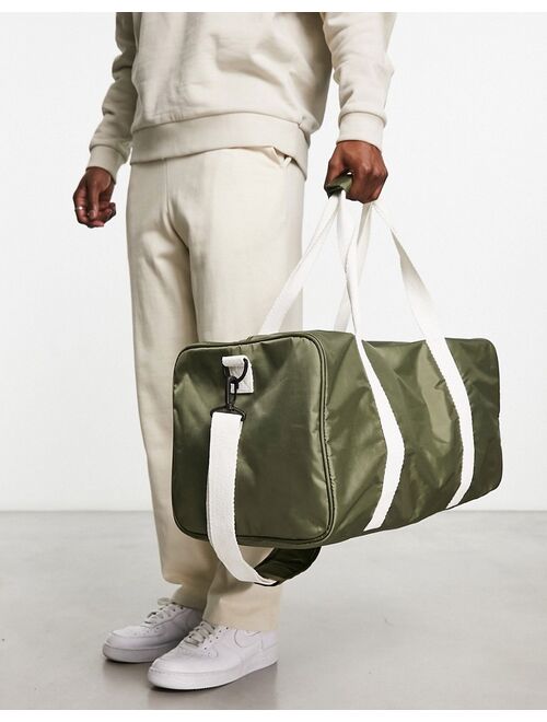 ASOS DESIGN canvas holdall bag with contrast strap in olive