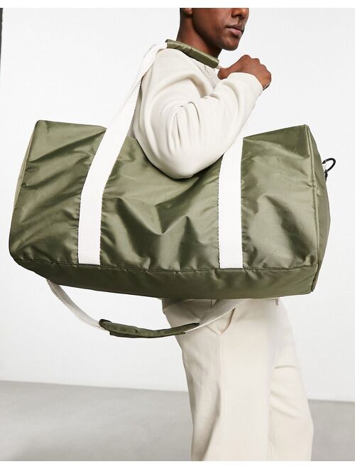 ASOS DESIGN canvas holdall bag with contrast strap in olive