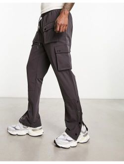 The Couture Club cargo pants in charcoal with snap hem