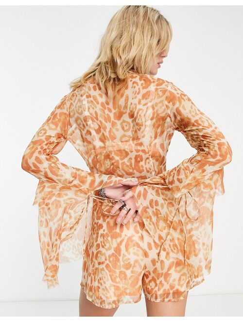 ASOS DESIGN deep V-neck ruffle sleeve romper in washed leopard print