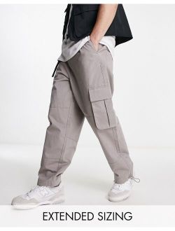 oversized tapered cargo pants in beige with belt