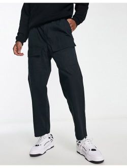 Intelligence wide fit cargo pants with front pocket in black
