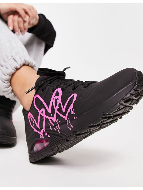 Skechers Uno sneakers with neon graffiti heart print in black
