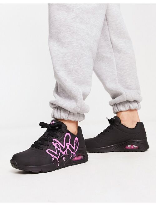 Skechers Uno sneakers with neon graffiti heart print in black