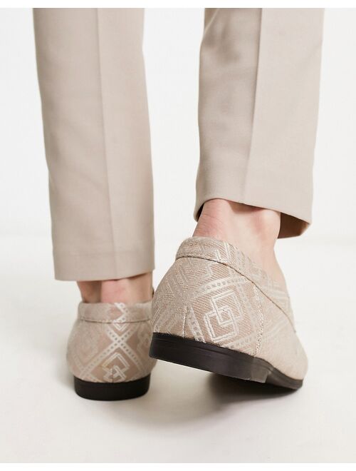 ASOS DESIGN loafers in brown monogram design with gold snaffle