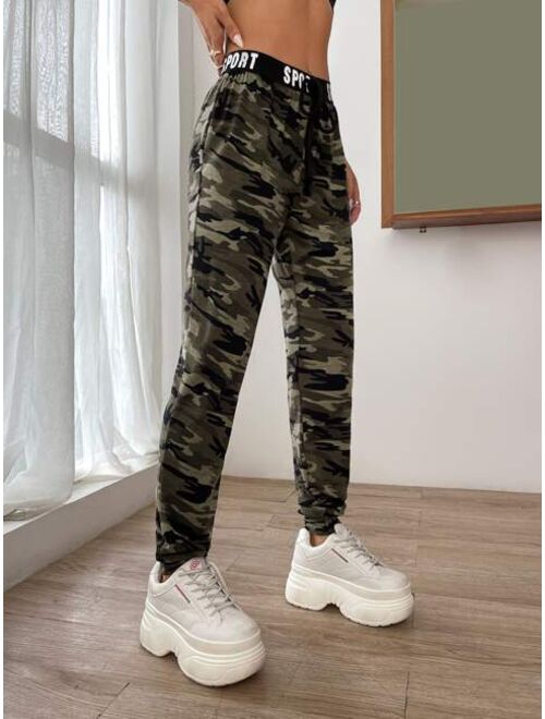 SHEIN EZwear Camo Print Knot Front Letter Tape Sweatpants