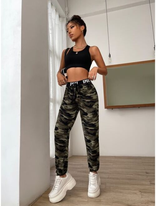SHEIN EZwear Camo Print Knot Front Letter Tape Sweatpants