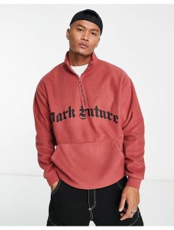 ASOS Dark Future oversized quarter zip sweatshirt in polar fleece with gothic logo in red