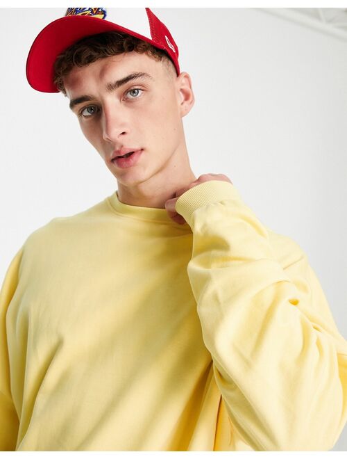 ASOS DESIGN super oversized sweatshirt in yellow