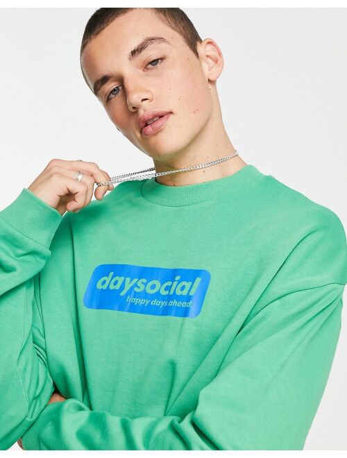 ASOS DESIGN ASOS Daysocial oversized sweatshirt with blue badge logo print in green