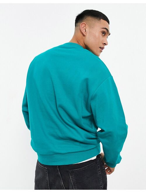 ASOS DESIGN oversized sweatshirt in teal green