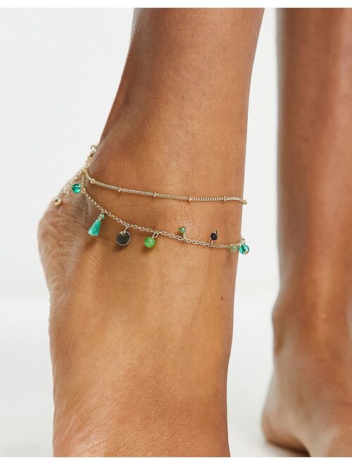 ASOS DESIGN multirow anklet with green bead and tassel design in gold tone
