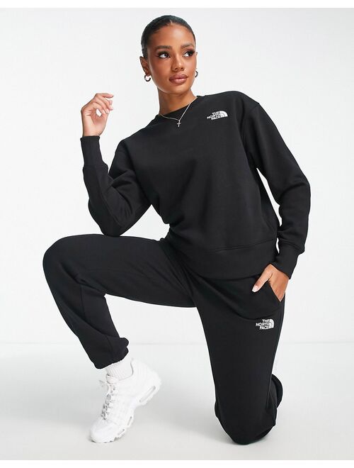The North Face Essential oversized sweatshirt in black Exclusive at ASOS