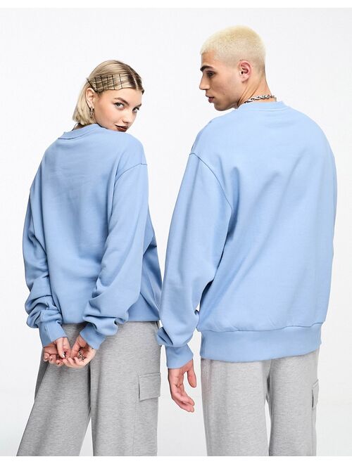 COLLUSION Unisex oversized varsity print sweatshirt in washed light blue