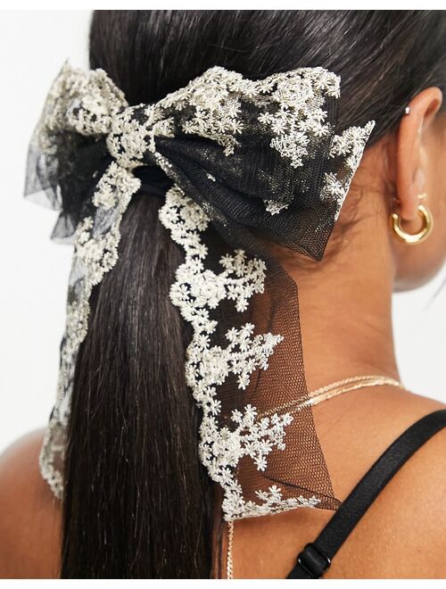True Decadence bow hair clip in black with cream lace