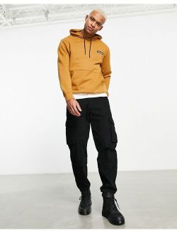 Woven Badge hoodie in wheat tan