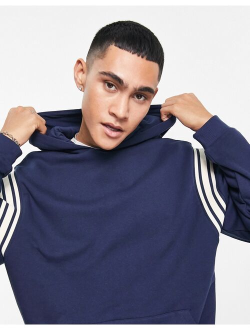 ASOS DESIGN oversized hoodie in navy with insert panels