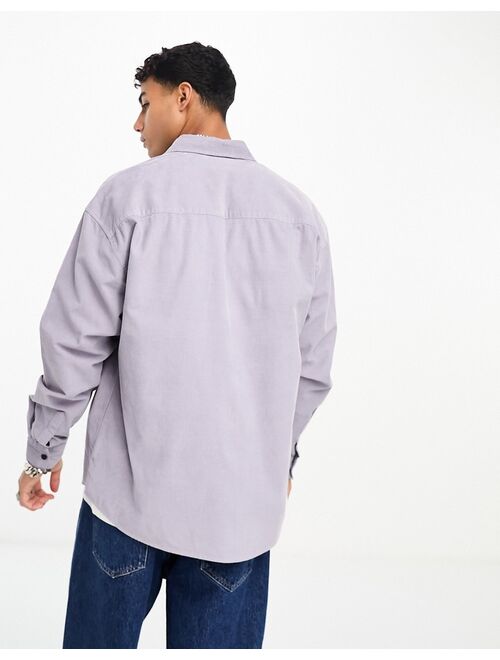 ASOS DESIGN 90s oversized cord shirt with oversized double side entrance pockets in lilac