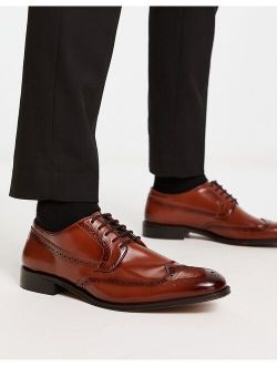 lace-up brogue shoes in polished tan leather