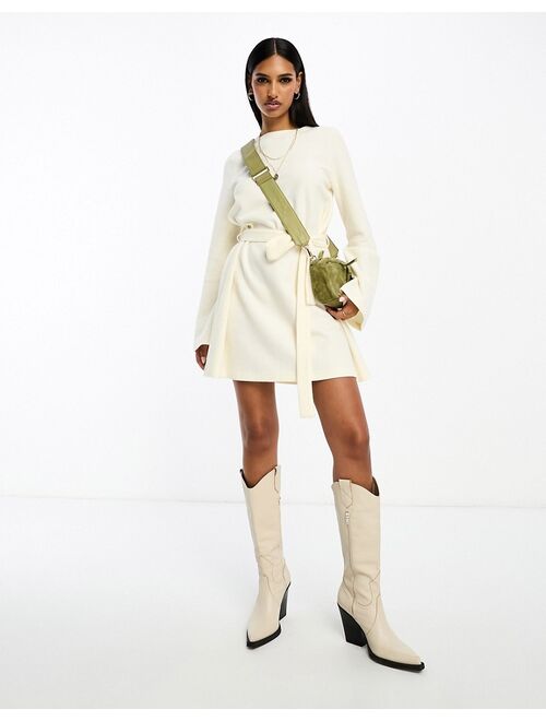 ASOS DESIGN super soft flare sleeve sweater swing mini dress with belt in winter white