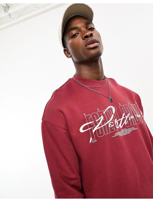 ASOS DESIGN oversized sweatshirt in burgundy with city print & embroidery