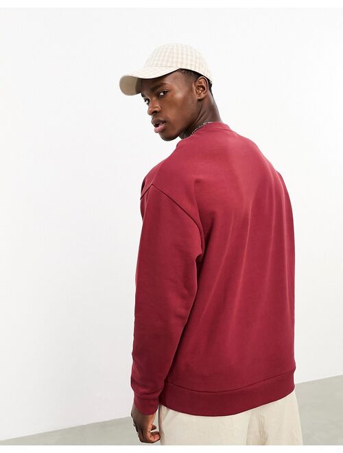 ASOS DESIGN oversized sweatshirt in burgundy with city print & embroidery