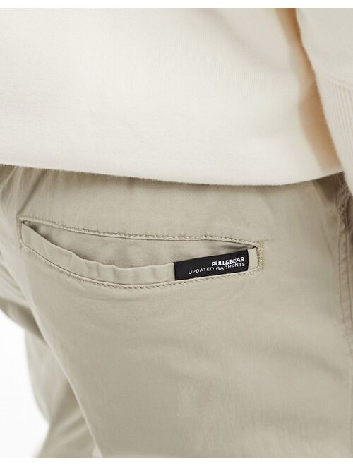 Pull&Bear parachute pants in sand