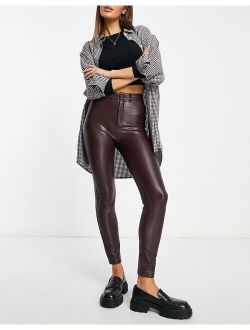 high waisted faux leather skinny pants in burgundy