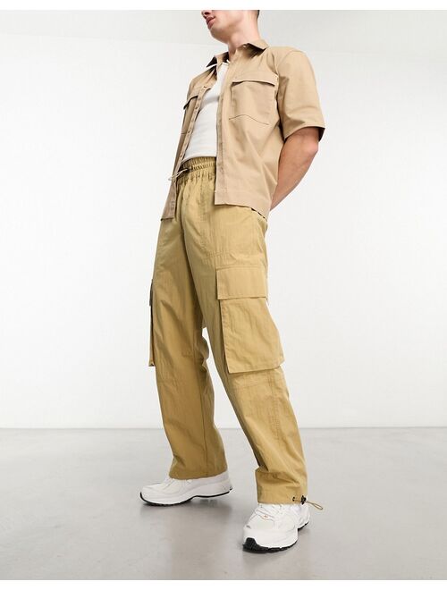 ASOS DESIGN wide leg nylon cargo pants with elastic waist in beige