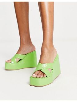 wedge crossover mules in green