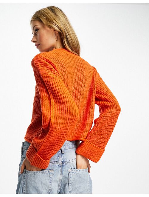 Vero Moda chuck on sweater with turn back cuffs in orange
