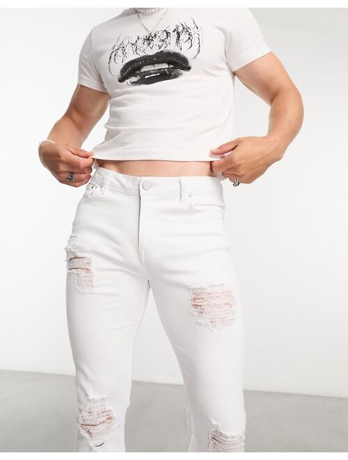 ASOS DESIGN flared jeans with distressed rips in white