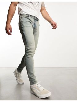 spray on jeans with power stretch in mid wash tint