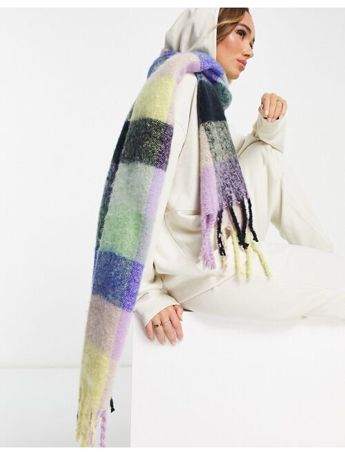 ASOS DESIGN fluffy tassel scarf in pastel and bright check