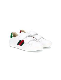 Kids touch fastening sneakers