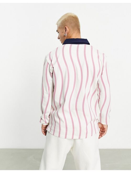 Fila Woodrow polo top with wavy print in white and pink
