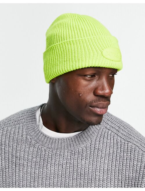 ASOS DESIGN deep turn-up beanie in neon lime with rubber patch